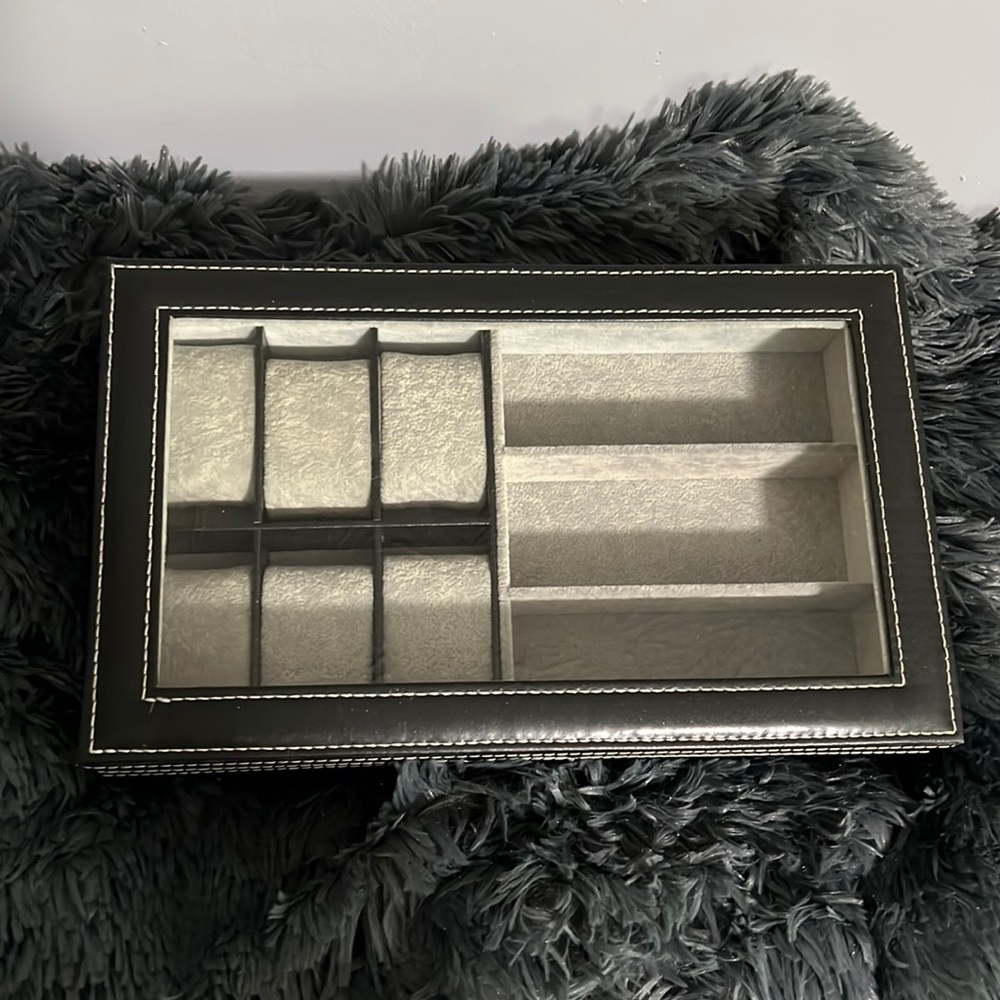 Black watch and sunglasses/jewelry box. Hinged back with with stitch trim.